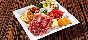 Antipasto dish on white ceramic plate