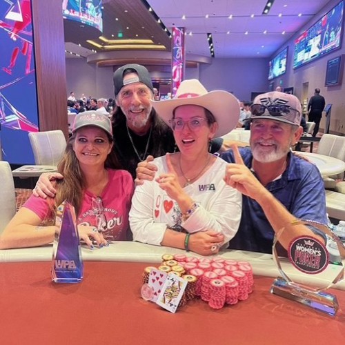 WOMEN WINNER FAMILY AT TABLE