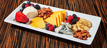 Artisan cheese platter on white ceramic plate